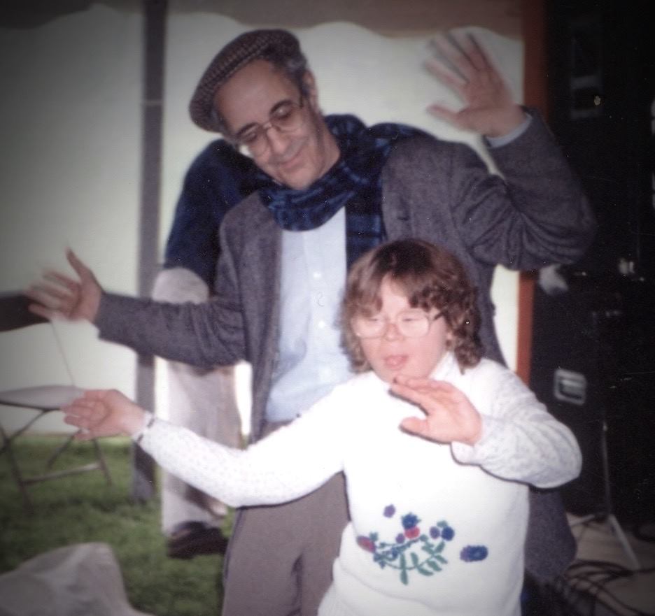 Henri Nouwen dancing with a person with intellectual disabilities.